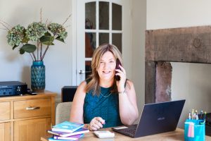 Sue Reeve found of the Business Finance Academy working at her desk.